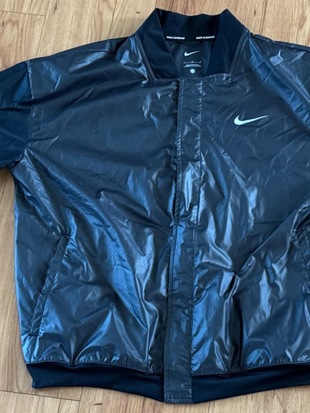 NWOT Nike Running jacket black size L womens reflective double swoosh on back